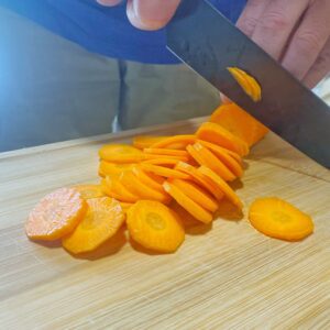 Indra from Love Being Served is cutting carrots