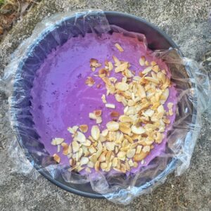 blackberry cake in the tin on a grey stone surface