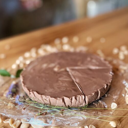 brown cake and peanuts on a wooden table