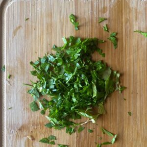 chopped parsley on a board