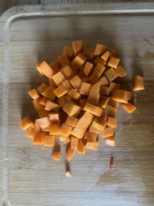 chopped carrots on wooden board