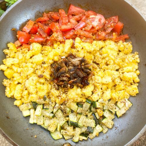 polenta and vegetables in a pan