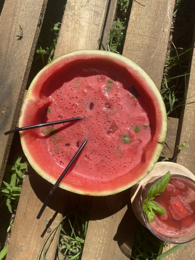 watermelon with juice on a wooden surface