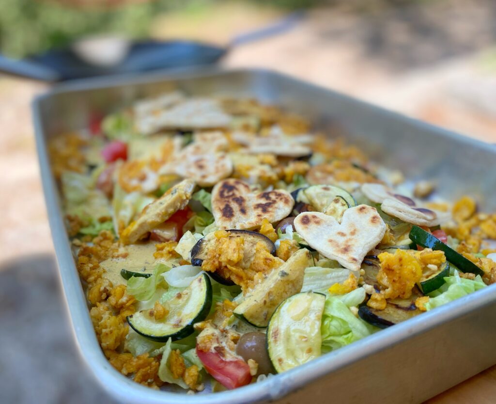 a mix of vegetable, crispy cornflakes tofu and else in a tray