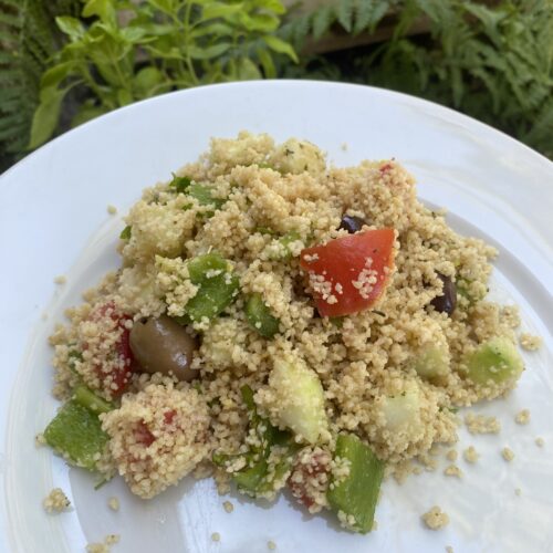 french couscous salad on a white plate